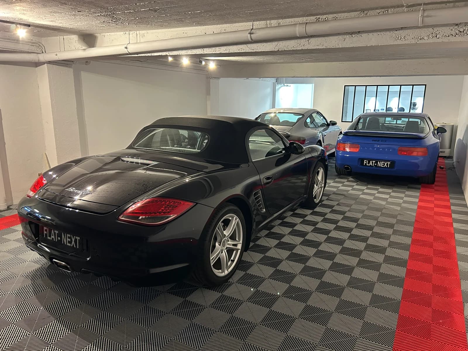 Three Porsche lined up in the FLAT NEXT showroom in Sarreguemines